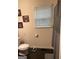 Simple bathroom with a window and shower/tub combination, scale, white toilet, and a clean, functional layout at 1063 Nw Cato Nw St, Atlanta, GA 30318