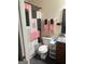 Cozy bathroom with stylish shower curtain and coordinating pink towels at 1063 Nw Cato Nw St, Atlanta, GA 30318