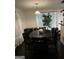 Elegant dining room with a dark wood table, seating for six, chandelier, and bright natural light at 1063 Nw Cato Nw St, Atlanta, GA 30318