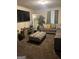 Cozy living room features a sectional sofa, ottoman, TV and decorative elements, great for entertainment at 1063 Nw Cato Nw St, Atlanta, GA 30318