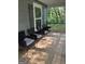 Inviting front porch featuring four chairs with a wooden deck, perfect for relaxing outdoors at 1063 Nw Cato Nw St, Atlanta, GA 30318