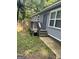 Side view of a home showing a back entrance with a small porch and steps at 1063 Nw Cato Nw St, Atlanta, GA 30318