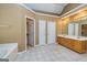 Bright main bathroom with double vanities, bathtub, and tiled floor at 195 Youngs Cir, Fayetteville, GA 30215