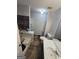 Bathroom featuring a tub-shower combination, tiled floors, and a vanity, ready for your personal touch at 35 Hampton Oaks Dr, Hampton, GA 30228