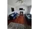 Bright living room with vaulted ceilings, a cozy fireplace, and hardwood floors, perfect for relaxation at 35 Hampton Oaks Dr, Hampton, GA 30228