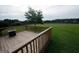 Large wooden deck overlooking an expansive and well-maintained lawn at 1204 Bent Creek Dr, Mcdonough, GA 30252