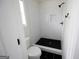 Modern bathroom with a tiled shower, and hexagon tile flooring at 1204 Bent Creek Dr, Mcdonough, GA 30252