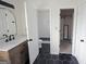 Bathroom featuring double sinks, and a walk in tiled shower at 1204 Bent Creek Dr, Mcdonough, GA 30252
