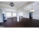 Bright and spacious living room with fireplace and decorative lighting fixtures at 1204 Bent Creek Dr, Mcdonough, GA 30252