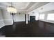 Spacious open-concept living room with high ceilings, fireplace, and ample light at 1204 Bent Creek Dr, Mcdonough, GA 30252