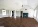 Open living room featuring fireplace, high ceilings, and ample natural light at 1204 Bent Creek Dr, Mcdonough, GA 30252