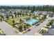 Great aerial view of neighborhood amenities including pool, playground, and surrounding residences at 206 Roundwood Way, Peachtree City, GA 30269
