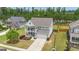 Aerial view of a home with manicured landscaping and a spacious front yard at 206 Roundwood Way, Peachtree City, GA 30269