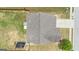 Aerial view shows the roof line of the house and fence in the backyard at 206 Roundwood Way, Peachtree City, GA 30269