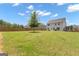 Fenced-in backyard featuring a lush lawn and mature trees at 206 Roundwood Way, Peachtree City, GA 30269