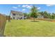 View of a large, fenced backyard and the rear of the house at 206 Roundwood Way, Peachtree City, GA 30269