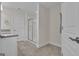 Bright bathroom showcasing glass enclosed shower, granite counters, and neutral tile floor at 206 Roundwood Way, Peachtree City, GA 30269