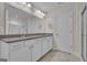 Bathroom with double sink vanity, white cabinets, granite countertops, and glass shower at 206 Roundwood Way, Peachtree City, GA 30269