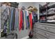 Organized closet with hanging racks and shelves to provide storage for clothing and accessories at 206 Roundwood Way, Peachtree City, GA 30269
