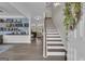 Welcoming foyer featuring beautiful flooring, staircase, and open access to living areas at 206 Roundwood Way, Peachtree City, GA 30269