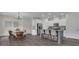 Modern kitchen with an island, stainless steel appliances, and a cozy breakfast nook at 206 Roundwood Way, Peachtree City, GA 30269