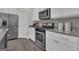 Well-equipped kitchen with stainless steel appliances and ample counter space at 206 Roundwood Way, Peachtree City, GA 30269