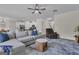 Bright living room boasts modern furnishings and connects seamlessly to the kitchen at 206 Roundwood Way, Peachtree City, GA 30269