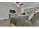 Comfortable main bedroom showcasing a ceiling fan, desk area and neutral tones at 206 Roundwood Way, Peachtree City, GA 30269
