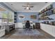 Stylish home office with custom built-in shelves, accent wall, and modern furnishings at 206 Roundwood Way, Peachtree City, GA 30269