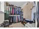 Walk-in closet with shelving, hanging racks, and compartments for shoes and clothing at 206 Roundwood Way, Peachtree City, GA 30269