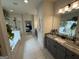Bright bathroom featuring double sink vanity and a separate shower and soaking tub at 442 Snow Owl Way, Lawrenceville, GA 30044