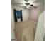 A charming bedroom featuring carpet, a ceiling fan, and a large window at 442 Snow Owl Way, Lawrenceville, GA 30044