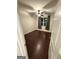 This cozy bedroom features dark hardwood floors, a ceiling fan, and a window with curtains at 442 Snow Owl Way, Lawrenceville, GA 30044