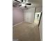 A comfortable bedroom with carpet, a double door closet, and a ceiling fan at 442 Snow Owl Way, Lawrenceville, GA 30044