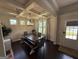 Bright dining room featuring coffered ceilings, a modern chandelier, and a large wooden dining table at 442 Snow Owl Way, Lawrenceville, GA 30044