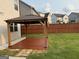 Wooden gazebo in a well-maintained backyard with green grass at 442 Snow Owl Way, Lawrenceville, GA 30044