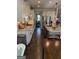 Well-lit kitchen featuring granite countertops, stainless steel appliances, and a view into the dining area at 442 Snow Owl Way, Lawrenceville, GA 30044