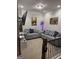 Cozy upstairs living area with comfortable seating, artwork, and TV at 442 Snow Owl Way, Lawrenceville, GA 30044