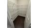 Well-organized pantry with wire shelving and ample storage space on a dark wood floor at 442 Snow Owl Way, Lawrenceville, GA 30044