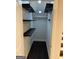 Walk-in pantry with dark wood shelving and recessed lighting at 442 Snow Owl Way, Lawrenceville, GA 30044