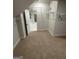 Spacious walk-in closet with access to the bathroom and built-in shelving at 442 Snow Owl Way, Lawrenceville, GA 30044