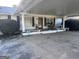 Charming brick home featuring an attached carport with a covered front porch and ample seating at 4160 Ewing Rd, Austell, GA 30106