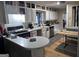 Bright kitchen featuring white cabinets, stainless steel appliances, and a breakfast bar at 4160 Ewing Rd, Austell, GA 30106