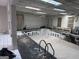 Indoor pool needing renovation with exposed ceiling and natural light from skylights at 4160 Ewing Rd, Austell, GA 30106