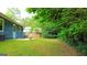 A spacious backyard featuring lush greenery and partial fencing for privacy at 1183 Iron Gate Blvd, Jonesboro, GA 30238