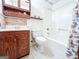 Cozy bathroom featuring a classic vanity, toilet, and shower-tub combo at 1183 Iron Gate Blvd, Jonesboro, GA 30238