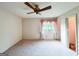 Spacious bedroom featuring a ceiling fan and a window with natural light at 1183 Iron Gate Blvd, Jonesboro, GA 30238