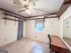 Bedroom with a ceiling fan, shelving, and a desk at 1183 Iron Gate Blvd, Jonesboro, GA 30238