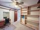 Bedroom with a ceiling fan, desk, mirror, and shelving at 1183 Iron Gate Blvd, Jonesboro, GA 30238