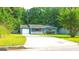 Charming one-story home with blue siding, red shutters, and a welcoming front porch at 1183 Iron Gate Blvd, Jonesboro, GA 30238